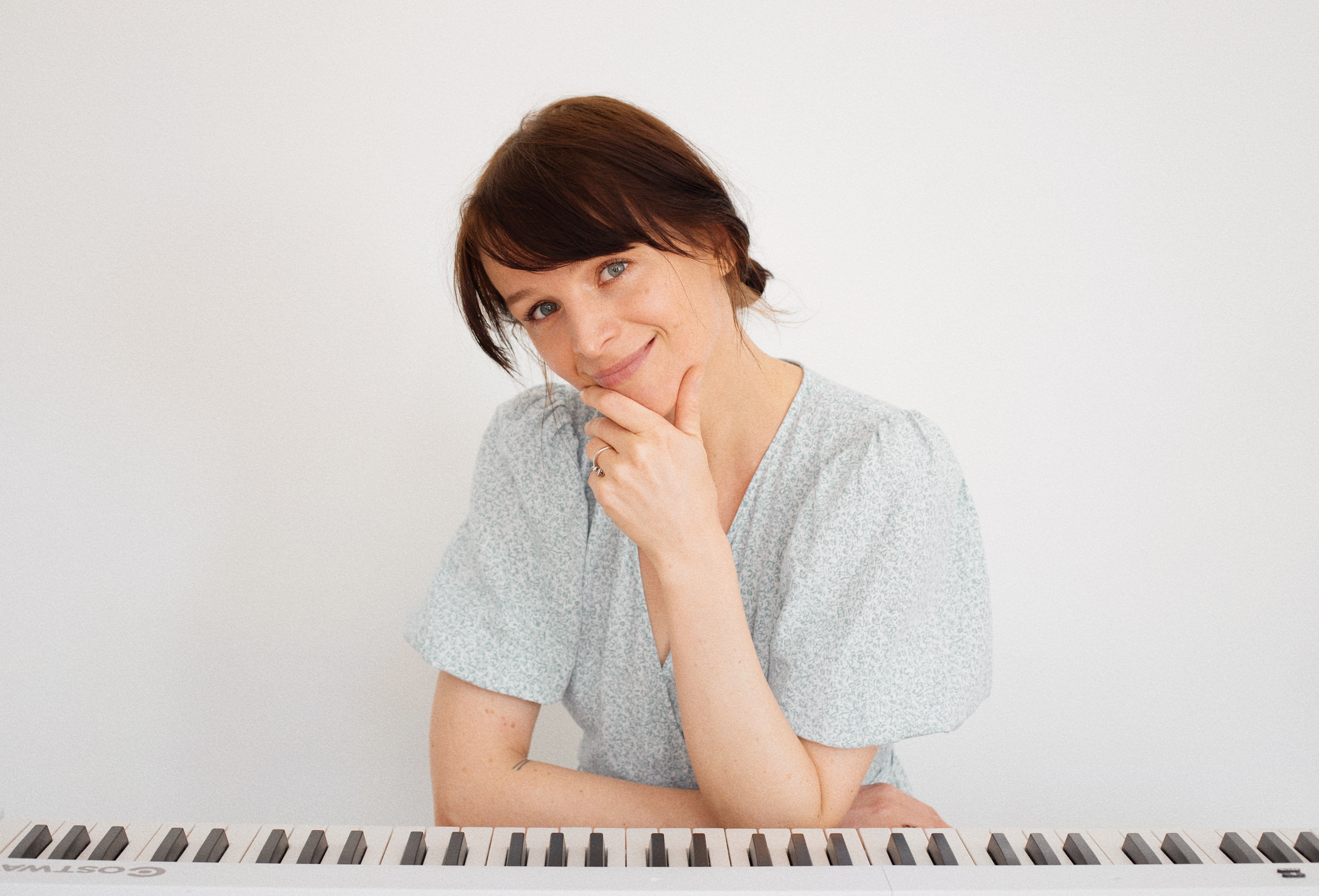 At the piano thinking